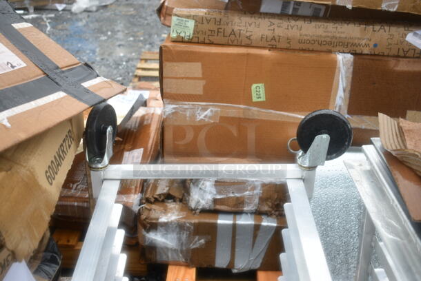 BRAND NEW SCRATCH AND DENT! Regency 600UPR8WTELS 8 Pan End Load Aluminum Undercounter Bun / Sheet Pan Rack with Stainless Steel Top. 2 Casters Need To Be Attached.  - Image 3 of 7