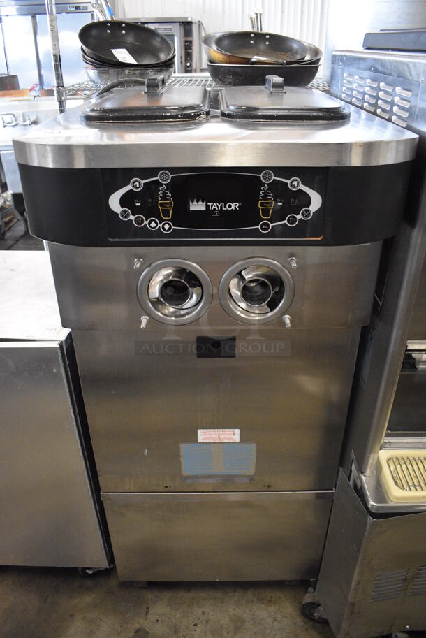 2012 Taylor Model C723-33 Stainless Steel Commercial Floor Style 2 Flavor w/ Twist Soft Serve Ice Cream Machine on Commercial Casters. Missing Pieces. 208-230 Volts, 3 Phase. 23x34x55