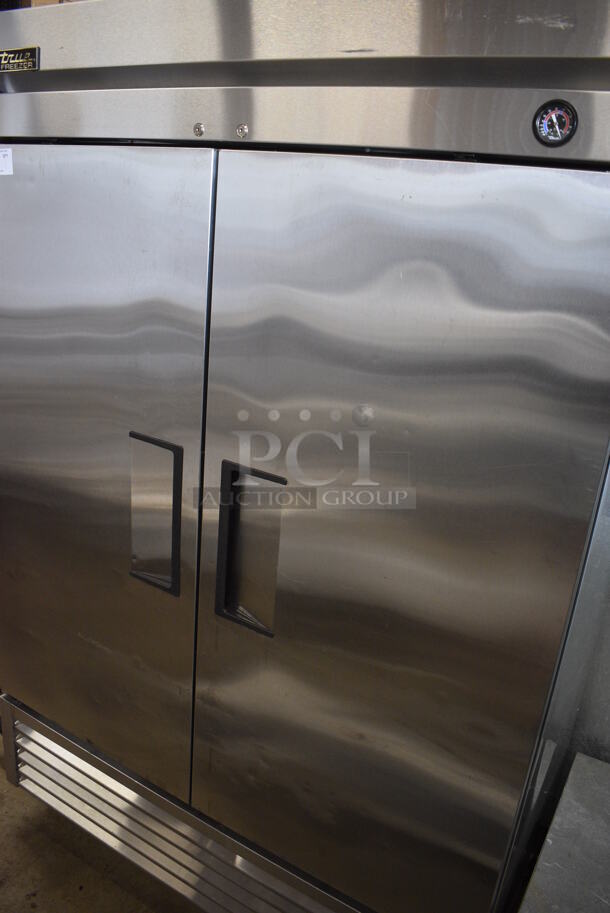 2015 True Model T-49F ENERGY STAR Stainless Steel Commercial 2 Door Reach In Freezer w/ Poly Coated Racks on Commercial Casters. 115 Volts, 1 Phase. 54x30x83. Tested and Powers On But Does Not Get Cold
