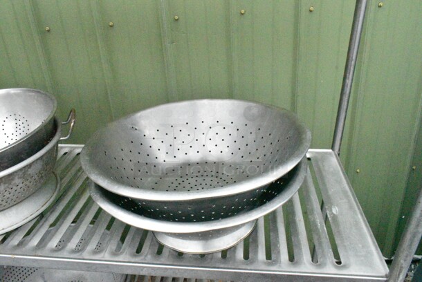 Metal 4 Tier Shelving Unit w/ Contents Including Colanders. BUYER MUST DISMANTLE. PCI CANNOT DISMANTLE FOR SHIPPING. PLEASE CONSIDER FREIGHT CHARGES.
 - Image 5 of 9