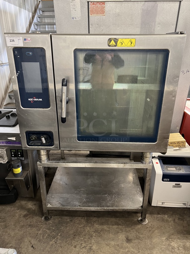 2015 Alto Shaam Model CTP7-20E Stainless Steel Commercial Combitherm Convection Oven on Stainless Steel Commercial Equipment Stand. 208-240 Volts, 3 Phase. 43.5x42x63
