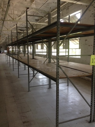 One Mega Lot Of Pallet Racking. 36 Uprights 10ftX3ft, 131 8' Beams, 64 Pieces Of 8X3 Wood, 193 Slates 3' Long.