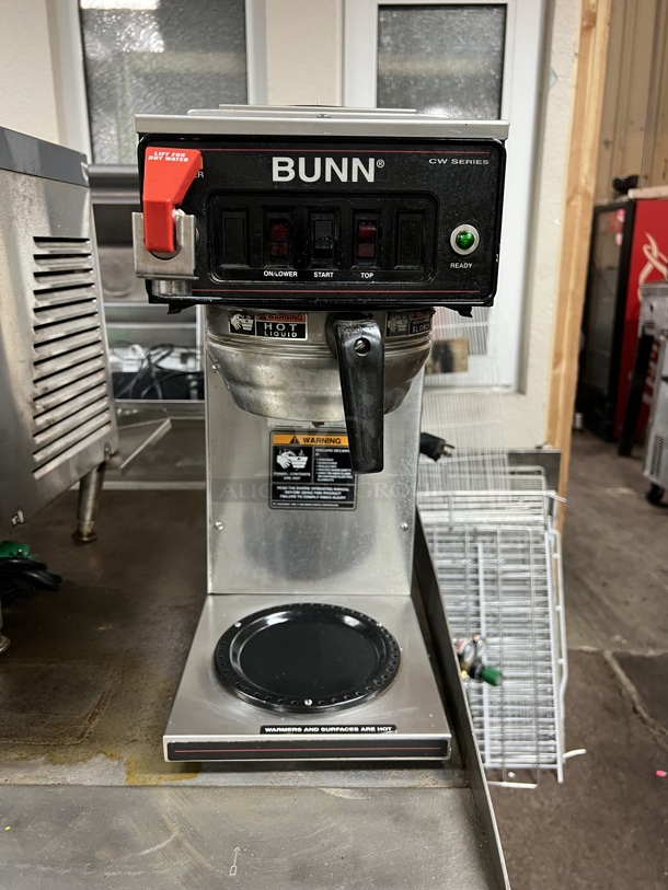 Bunn CW Series  115 volt. This coffee brewer is an excellent addition to any church function, break room, waiting area, or other light duty application where a reliable source of coffee is needed. It brews coffee at optimum temperatures for a rich, consistent product every time. Featuring 1570W of power, this unit allows you to brew up to 60 cups per hour.  Tested & Working!