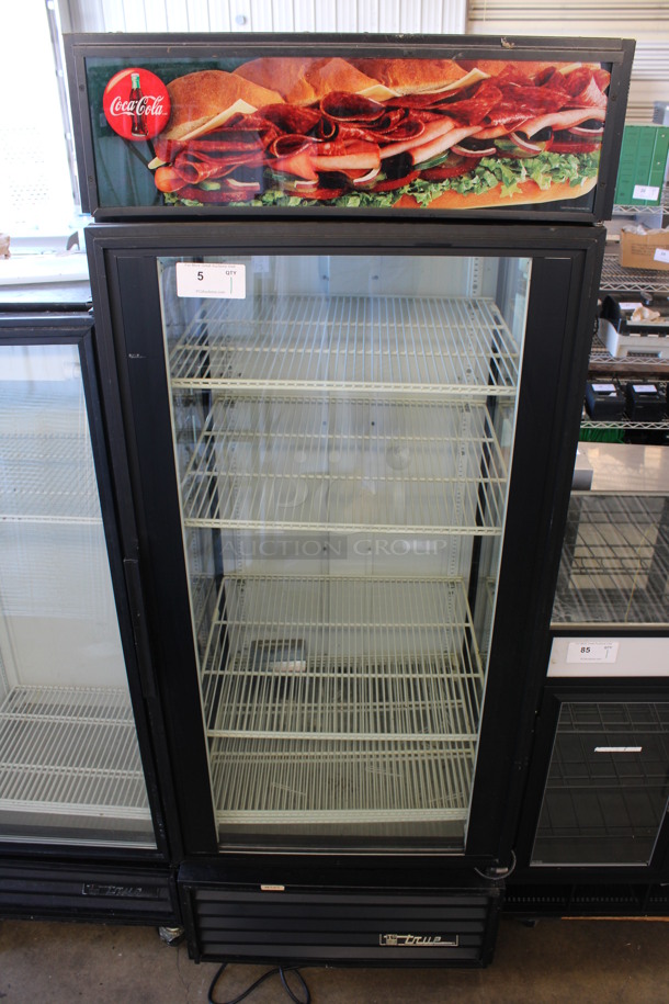 True Model GEM-26 Metal Commercial Single Door Reach In Cooler Merchandiser w/ Poly Coated Racks on Commercial Casters. 115 Volts, 1 Phase. 30x30x81. Unit Is Missing Compressor