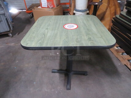 One Green Laminate Table Top On A Pedestal Base. 30X30X29.5