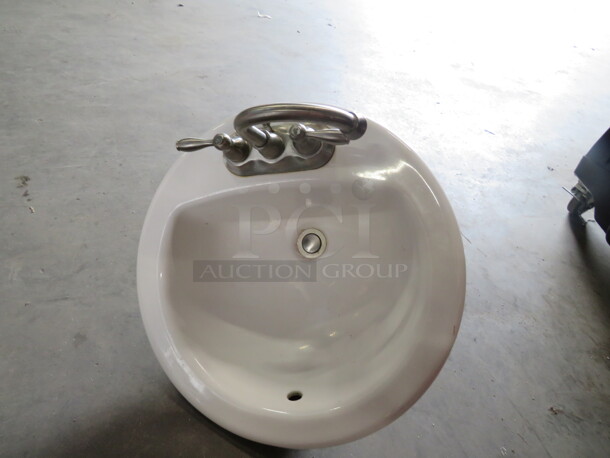 One 19 Inch Round Sink With Faucet.