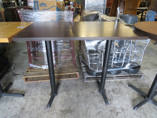 One Brown Laminate Table Top On A Bar Height Dual Pedestal Base. 48X30X42