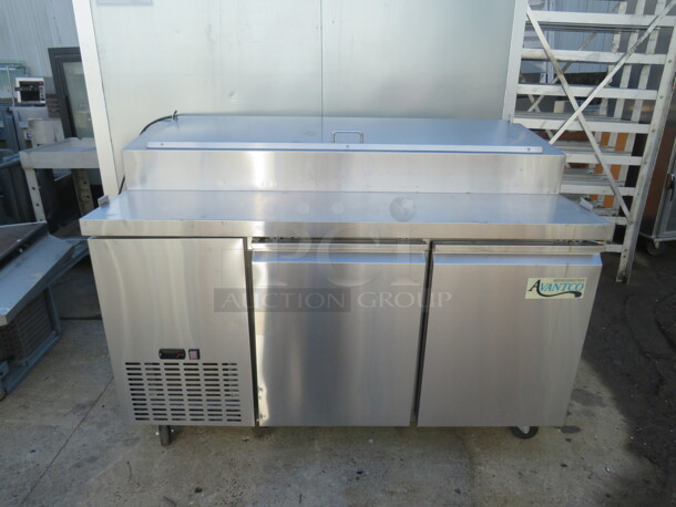 One WORKING Stainless Steel 2 Door Avantco Refrigerated Prep Table, With 2 Racks, on Casters. Model# 178PICL260HC. 115 Volt. 60X31.5X43. $2199.00.  - Image 1 of 3