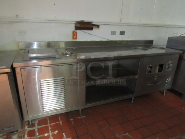 BUYER MUST REMOVE! One Stainless Steel Work Table With 1 Door Ice Cream Well, 2 Heated WELLS 10 Inch Well #S13LTD, And 1 Wells Heated Drawer  #RW-1HD. 102.5X28X40