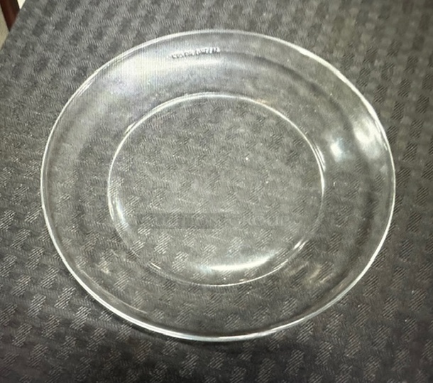 6-3/4 Inch Round Clear Glass Plate. 10XBID - Image 1 of 1