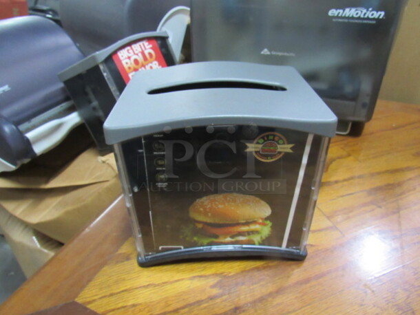 One Complete 360 Table Top Napkin Dispenser. - Image 1 of 1