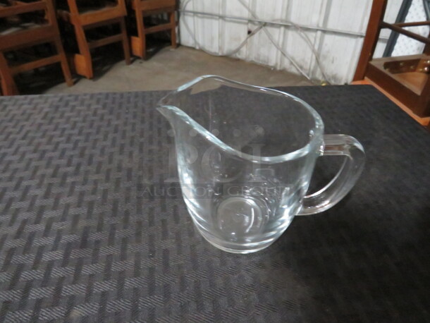 One Lot Of 24 Glass Creamers.  - Image 1 of 1