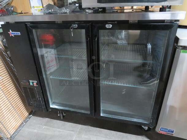 One WORKING Omcan 2 Door Back Bar Cooler With 4 Racks With Keys On Casters. Model# UBB-24-48G-HC. 115 Volt. 49X24X41
