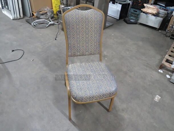 Metal Stack Chair With Cushioned Seat And Back. 5XBID - Image 1 of 3