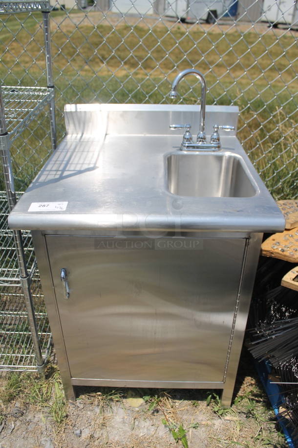 Commercial Stainless Steel Hand Sink With Backsplash And Gooseneck Faucet On Single Door Open Cabinet Base. - Image 1 of 7