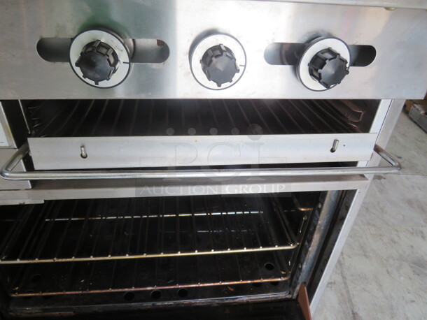 One Garland 6 Burner/24 Inch Griddle Natural Gas Range With 4 Racks, Over Shelf And Salamander. Model# H283. 60X33X59 - Image 6 of 6