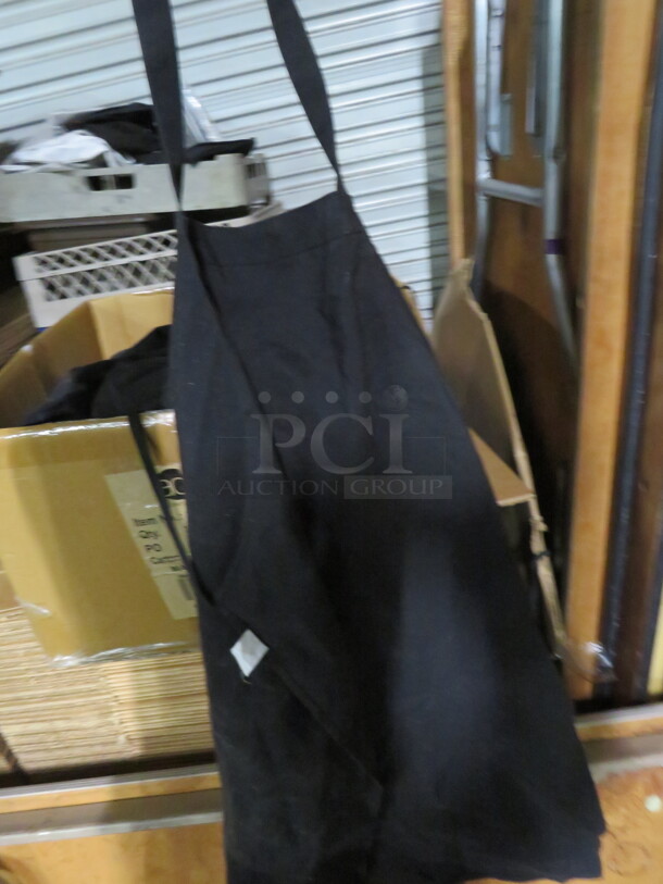 One Mega Lot Of Black Aprons.  - Image 1 of 2