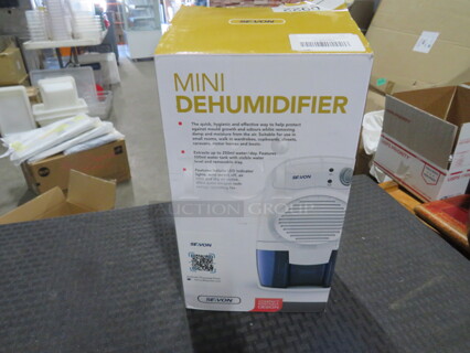 One NEW Seavon Mini Dehumidifier.