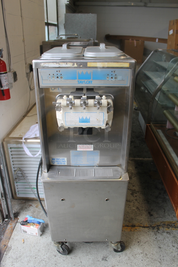 Taylor 794-33 Stainless Steel Commercial Floor Style Air Cooled 2 Flavor w/ Twist Soft Serve Ice Cream Machine on Commercial Casters. 208-230 Volts, 3 Phase. - Image 1 of 7