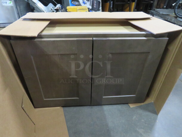 One NEW Echelon Maple 2 Door Wall Cabinet In A Storm Finish. #W2718BD. 27X12X18