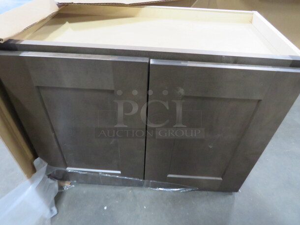 One NEW Echelon Maple 2 Door Wall Cabinet In A Storm Finish. #W2418BD. 24X12X18