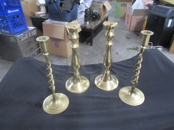 One Lot Of 4 Brass Candle Holders.