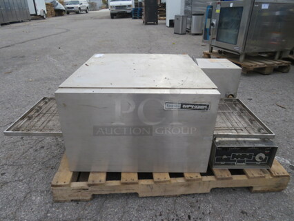 One Lincoln Impinger Pizza Oven. 120/208 Volt. 3 Phase. 56X37X17