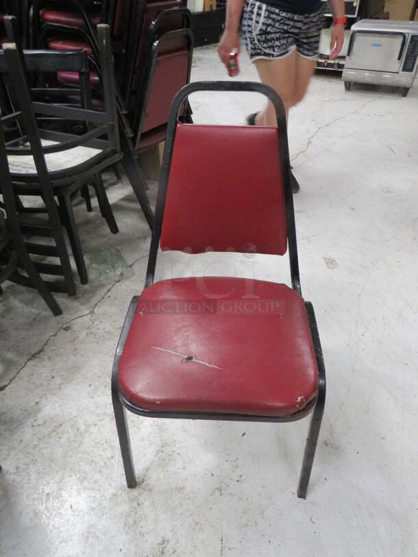 Black Metal Stack Chair With Cushioned Seat And Back. 6XBID - Image 1 of 1