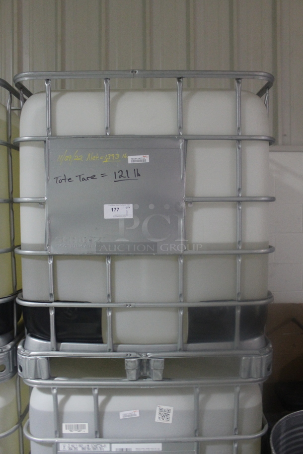 White Poly Tank in Metal Cage. BUYER MUST REMOVE. - Image 1 of 4