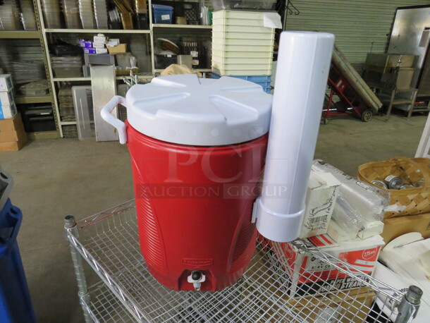 One Rubbermaid Beverage Cooler With Cup Dispenser.