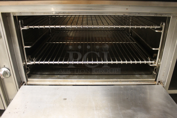 Jade Commercial Stainless Steel Heavy Duty Natural Gas Powered Range With Griddle Top And Standard Oven With Steel Racks On Commercial Casters. - Image 5 of 8