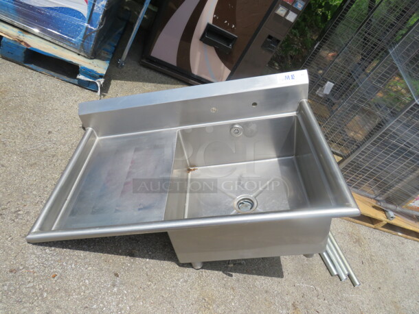 One Stainless Sink With  Left Side Drain Board. 45X29X40. Legs Need Reattached. Sink 24X24X11. 