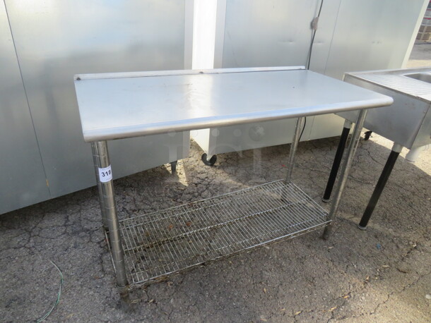 One Stainless Steel Table With Metro Under Shelf. 49.5X24X35