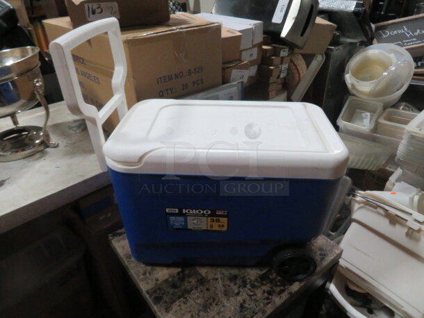 One Igloo 38 Quart Cooler With Wheels And Handle.
