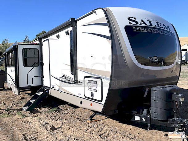 ? 2021 Forest River Salem Hemisphere 271RL-W 34ft 7in Travel Trailer With Upgraded Options Package & VIP Package. ? Includes All Original Paper Work. In LIKE NEW CONDITION minus a scratched piece of flooring on the kitchen side by the push out (see Photos).

MORE PHOTOS ON NUMBER 420 - Video on our Facebook Page: PCI Auctions West Coast
TRAVEL TRAILERS STANDARD FEATURES
• Extra Large Pass Thru Storage
• Versa Queen in Bunk Slides Standard
• European Oak colored horizontal plank linoleum Flooring
• Outside Kitchen Standard (270FKS, 273RL, 310BHI, 314BUD)
• Saddle colored wood cabinetry w/ matte black hardware
• Side-Mounted Heat Ducts
• Pantry Doors w/ Glass Inserts & Motion Sensor Pantry Lights
• Stackable Washer/Dryer Prep Std. on 270FKS, 308RL, 310BHI
• 7-Way “Rain Defense” Plug Holder (Front Frame)
• Wide Stance Axle System
• 2-Tone Painted Fiberglass Front Cap with Automotive Windshield
(N/A Windshield 308RL)
• Hidden Hinges on Cabinet Doors
• 50 Amp Service Standard
• 10 CU FT Black Refrigerator (12V)
• Laminated “Aluma Frame” Sidewalls and Floor with Block
Foam Insulation
• Heated & Enclosed Underbelly
• Radial Tires with Black-Accented Aluminum Rims
• Interior Grab Handle at Entry Door
• Shaded Pet Tether/Security Hook
• LED-Lit Theater Seating with Recliners (Most Models) • Designer’s Choice Luxury Comforter
• Exterior Bottle Opener

UPGRADED OPTIONS PACKAGE (INCLUDED)
• High Rise Faucet with Pull-Out Sprayer
• Spare Tire & Carrier
• Outside Shower
• 15,000 BTU A/C Ducted with Quick Cool
• Ivory Performance Colored Exterior Fibererglass with
Smoked Quartz Metallic Accents • Central Switch Center
• Solar Prep
• Lippert “On The Go” Ladder Prep • LP Quick Connect
• Extra Wide 30” Entrance Door
• Tri-Fold Sleeper Sofa or Theater Sofa

VIP PACKAGE (INCLUDED)
• Extra Large Max-Tint Panoramic Window Package
• 12V Heat Pads on All Holding Tanks
• Recessed Glass Stove Top Cover
• Midnight Glass Range Hood
• Midnight Glass Microwave
• Back Up Camera Prep
• Step Above Aluminum Entry Steps (Main Entry Door)
• 50” LED TV & Furrion Soundbar with FM, Bluetooth, HDMI, & USB • Stainless Steel, Single Bowl Undermount Sink with Roll Up
Sink Cover
• Power Stabilizer and Tongue Jacks
• Friction Door Hinge
• Baggage Door Magnets and Easy Pull Slam Latches
• LED Awning, Front Cap, Marker and Tail Lights
• 31” Glass Mirror Front Electric Fireplace
• Porcelain Toilet - Image 6 of 12