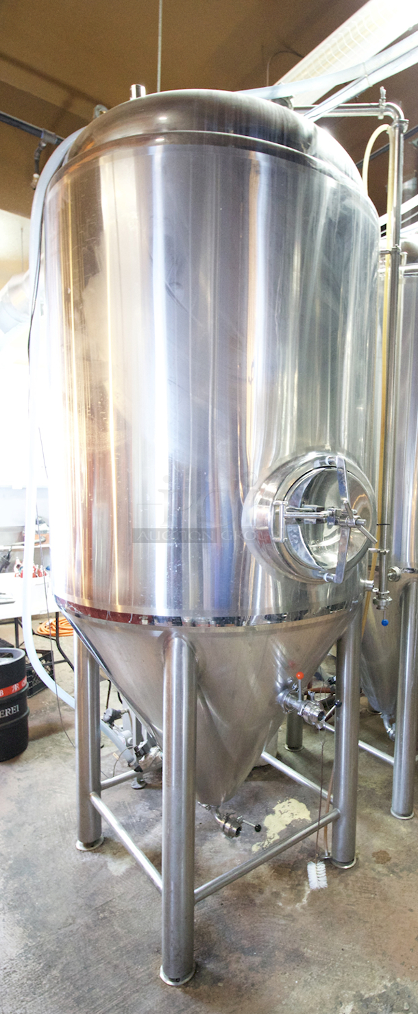 ? ? BEAUTIFUL!! Stout Tanks & Kettles - 15 BBL Fermenter / Unitank (Jacketed). ? ? Features: Easily Converts to a Unitank or Brite Serving Tank; Glycol Jacketed - 2 Zones: Cone and Sidewall; Shadowless Manway for Easy Cleaning; Adjustable Racking Arm for Clear Transfer; 1.5" Sample Valve for Quality Testing; Back Mounted Pressure Gauge; Adjustable Feet for Leveling on Uneven Floors or Fine Height Adjustments; Pressure Gauge Type: Back Mount; CIP Arm and 2.5" Rotating CIP Spray Ball; 2 Butterfly Valves; Rated to 2-Bar (29 PSI); 1/2" NPT Welded Thermowell for Contactless Temperature Probe Tank Thickness: 3mm Jacket and Outer Shell Thickness: 2mm. Cone: 60 degree Interior Angle. 51.5-in. diameter x 125-in.H. - Image 5 of 8