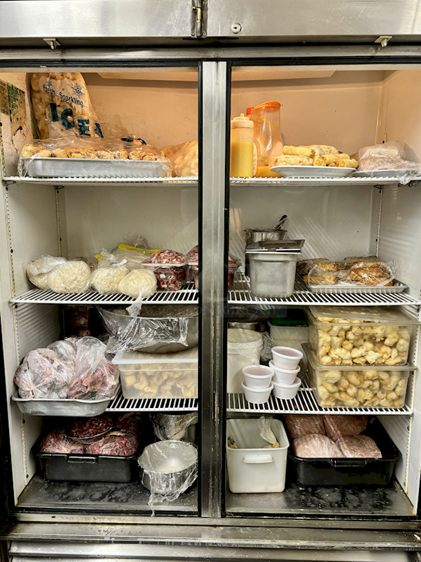 IN PERFECT WORKING ORDER! True T-49 54 1/8" Solid Door Reach-In Refrigerator, 44.6 cu. ft., On Commercial Casters. 115v, 1Ph, 5.4Amp, 60hz 54-1/8x29-1/2x83-3/8 Food Is Pictured To Demonstrate Unit Is In Working Order, NOT INCLUDED. - Image 2 of 4