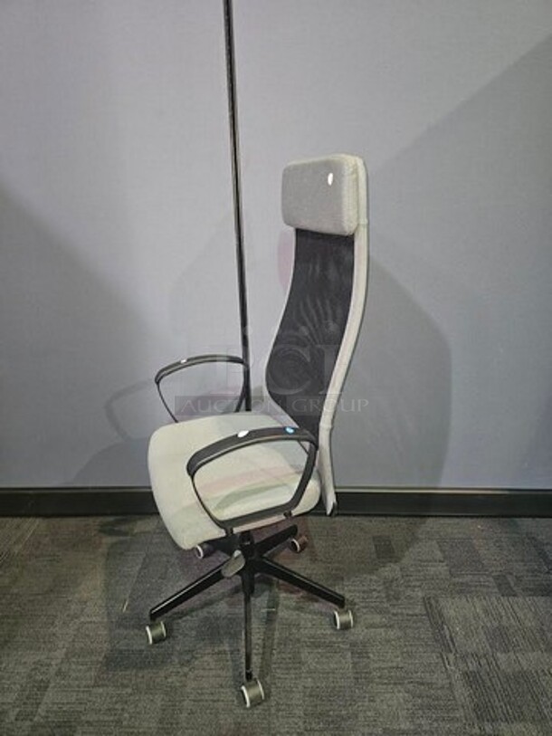 IKEA Markus adjustable office chair- grey and black in color with lumbar support and cushioned head rest. In good condition with minor signs of use, no tears or rips. No stains, nothing broken. Measures 54” H x 24.5” W. 

  - Image 2 of 3