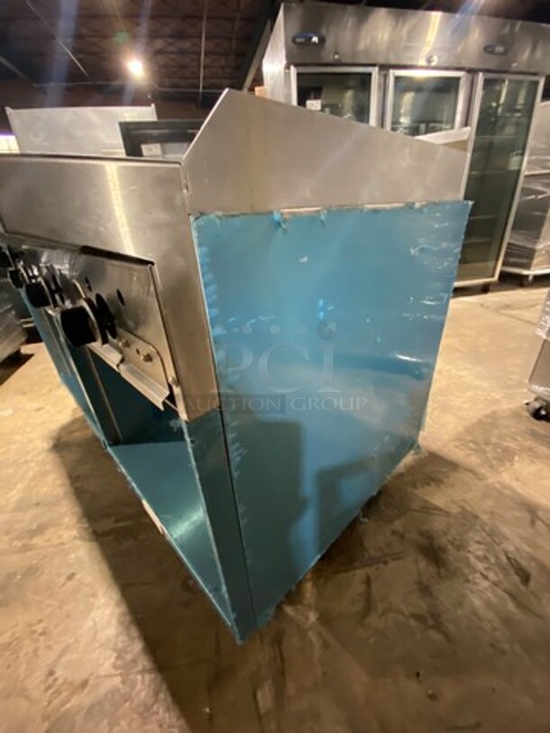 WOW! NEVER USED! Garland Commercial Natural Gas Powered 4 Burner Stove With Right Side Flat Griddle! Griddle Has Back And Side Splashes! With 2 Compartment Storage Space Underneath! All Stainless Steel! On Casters! Model: G604G36SS SN: 1712100102342 - Image 2 of 12