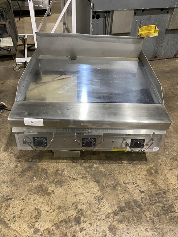 SWEET! BRAND NEW! NEVER USED! RARE FIND! Garland Commercial Natural Gas Powered Mirror Shine/Chrome Top Flat Griddle! Thermostatic Controlled! With Back & Side Splashes! Model GG36H Serial 2305100102118! On Small Legs!  - Image 1 of 9