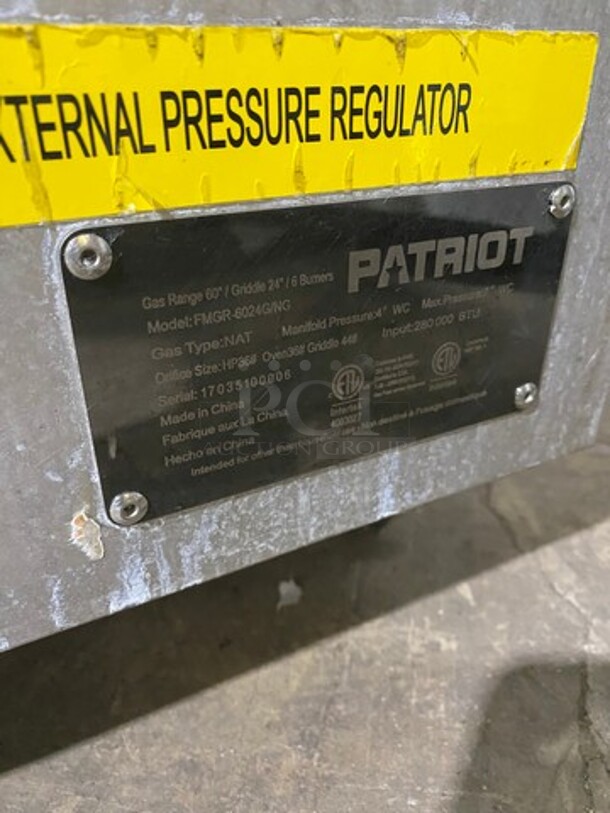 Patriot Commercial Natural Gas Powered 6 Burner Stove With Flat Griddle! Flat Griddle Has Side Splashes! With Raised Back Splash! With 2 Oven Underneath! Metal Oven Racks! All Stainless Steel! On Casters! Model: FMGR6024GNG SN: 17035100006 - Image 11 of 12
