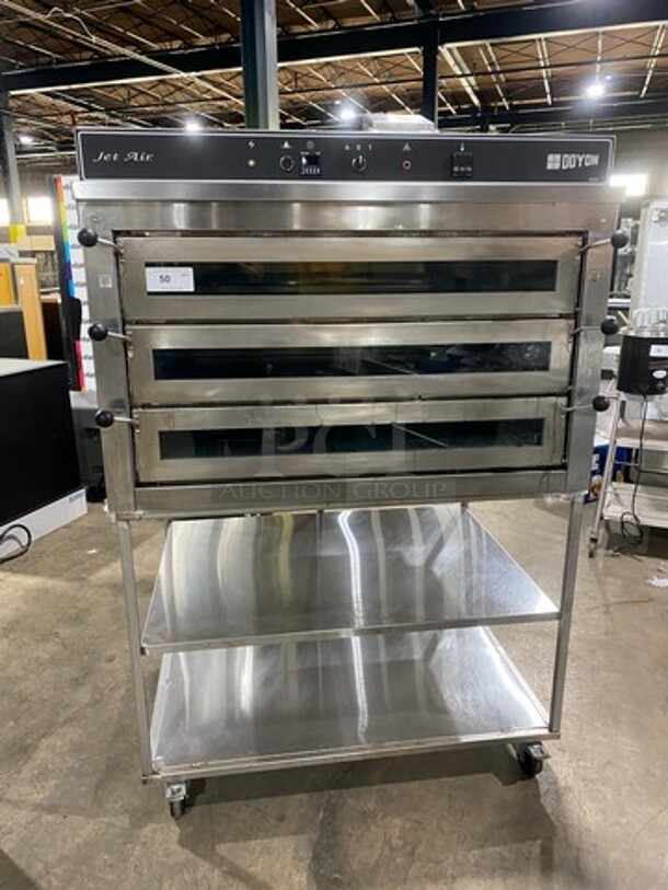 WOW! 2012 Doyon Commercial Natural Gas Powered Tripple Deck Pizza/ Baking Oven! With Shelf Storage Underneath! All Stainless Steel! On Casters! Model: PIZ6G SN: 282200000112 - Image 1 of 11