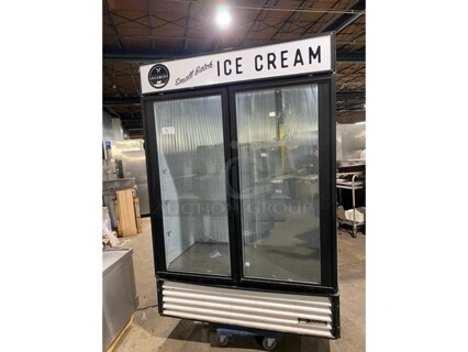 Nice! True GDM-49F Metal Commercial 2 Glass Door Reach In Freezer Merchandiser w/ Poly Coated Racks on Commercial Casters. 115 Volts, 1 Phase