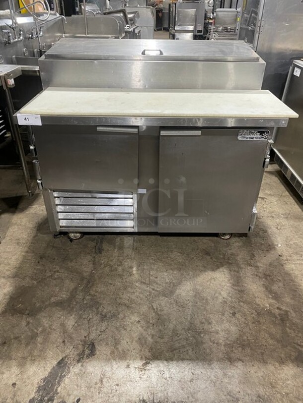 Leader! Stainless Steel Pizza Prep Table! Double Cold Storage! with/ Poly Cutting Board! On Wheels!
115V! 1 Phase! 60 HZ! - Image 1 of 9