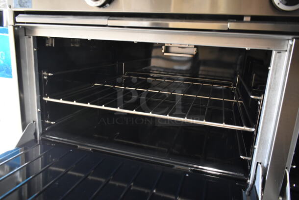 BRAND NEW SCRATCH AND DENT! 2023 Garland G60-4G36RR Stainless Steel Commercial Natural Gas Powered 4 Burner Range w/ Flat Top Griddle, 2 Ovens, Back Splash and Over Shelf. Stock Picture Used as Gallery. - Image 6 of 10