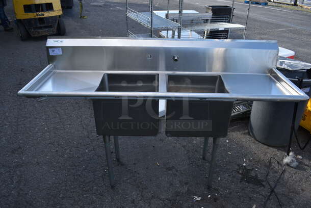 Stainless Steel Commercial 2 Bay Sink w/ Dual Drain Boards, Faucet and Handles. 72x23x45. Bays 17x17x12. Drain Boards 16.5x19x1