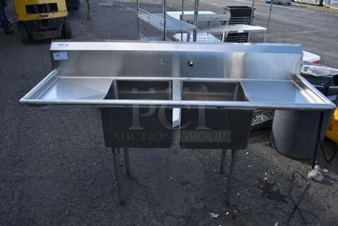 Stainless Steel Commercial 2 Bay Sink w/ Dual Drain Boards, Faucet and Handles. 72x23x45. Bays 17x17x12. Drain Boards 16.5x19x1