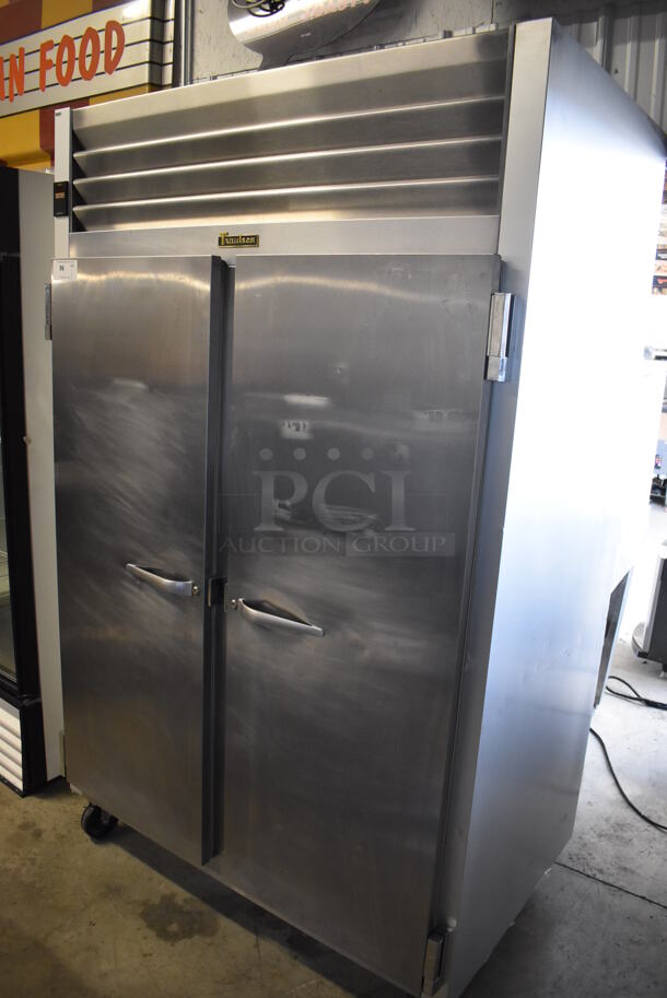 Traulsen G20010 ENERGY STAR Stainless Steel Commercial 2 Door Reach In Cooler on Commercial Casters. 115 Volts, 1 Phase. 52x35x83.5. Tested and Powers On