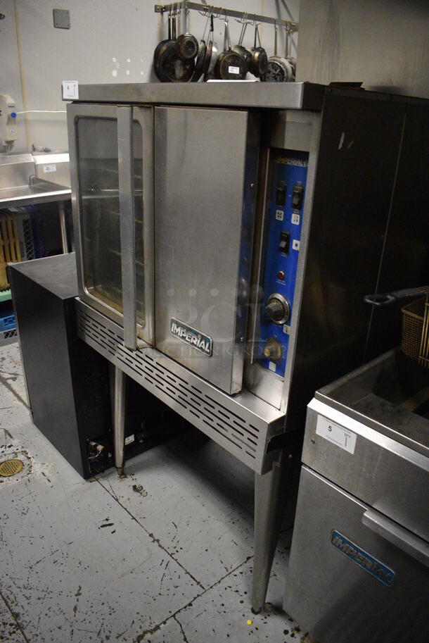 Imperial Stainless Steel Commercial Gas Powered Full Size Convection Oven w/ View Through Door, Solid Door, Metal Oven Racks and Thermostatic Controls on Metal Legs. 36x41x61. BUYER MUST REMOVE. Item Was in Working Condition on Last Day of Business. (kitchen) - Image 2 of 6