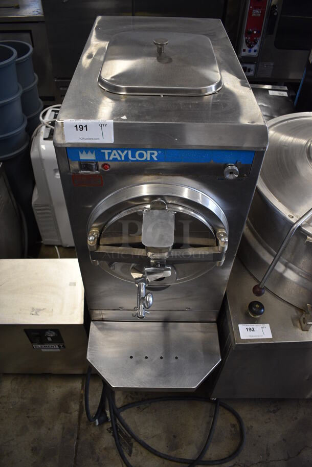 Taylor Model 220-27 Stainless Steel Commercial Floor Style Water Cooled Batch Freezer on Commercial Casters. 208/230 Volts, 1 Phase. 18x38x56